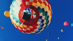 The cover image of the article describing what Helm is representing hot air baloons with a beautiful blue sky